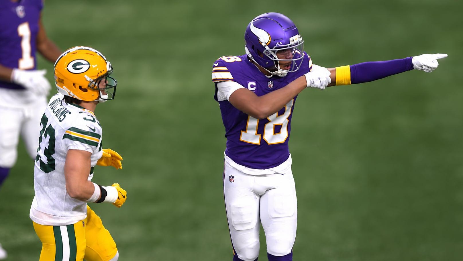 Justin Jefferson points during Vikings-Packers Week 18 action.