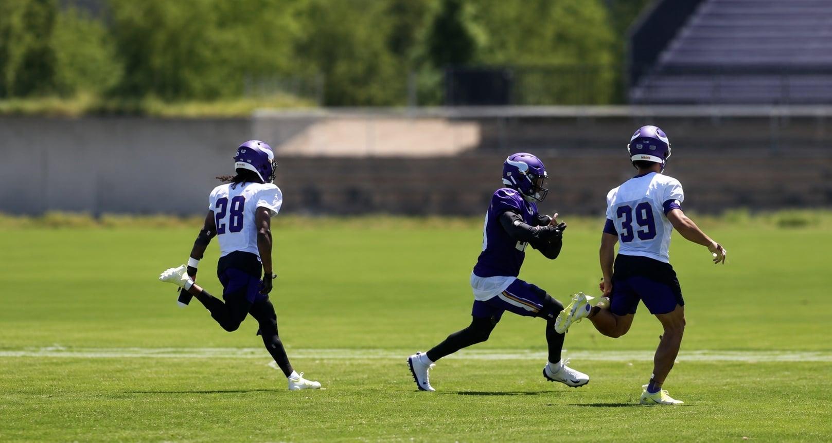 Kyler Murray throws a pass to Dillon Bell during Vikings minicamp practice in Eagan.