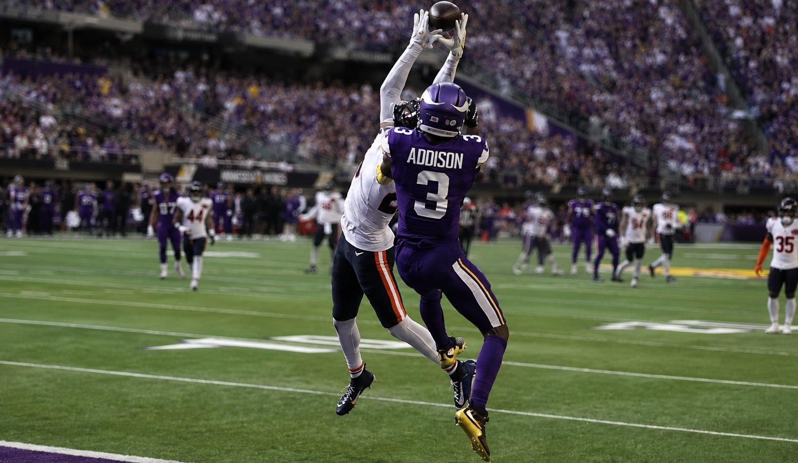 Jordan Addison battles Nahshon Wright for a contested catch against the Bears.