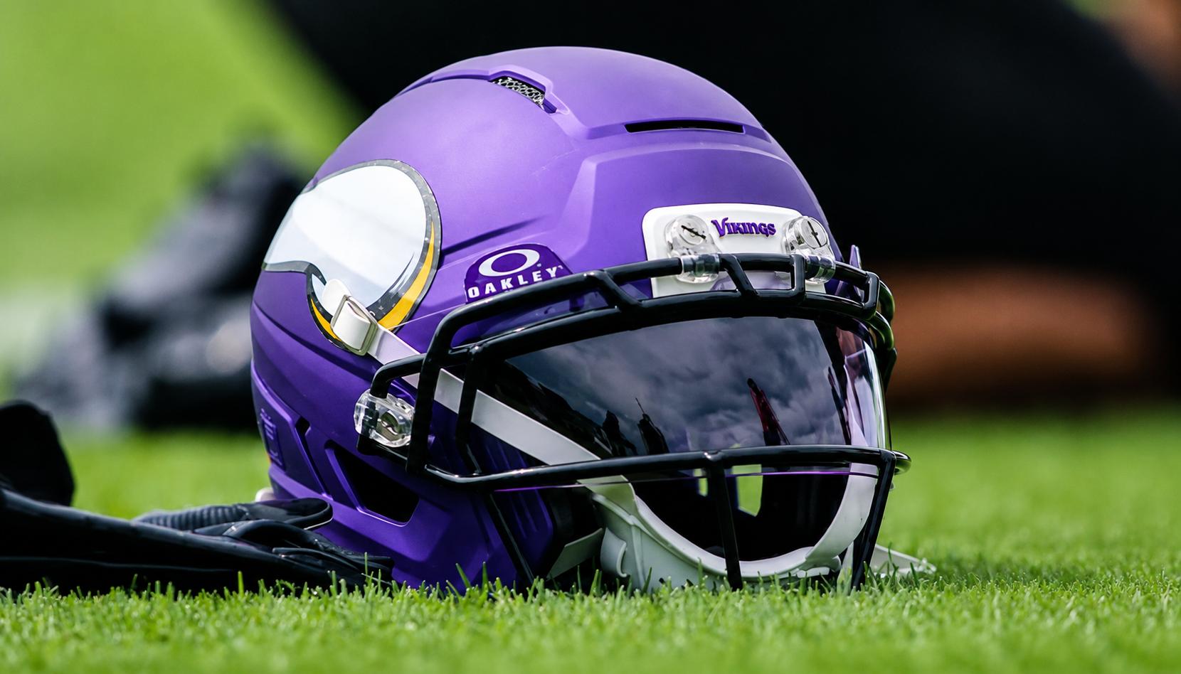 A Minnesota Vikings helmet sits on the practice field during OTA activities in Eagan.