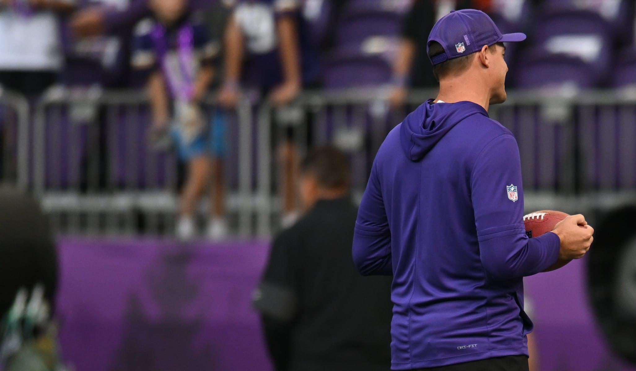 Kevin O’Connell and Zac Taylor speak on the field before a Vikings-Bengals game at U.S. Bank Stadium in Minneapolis.