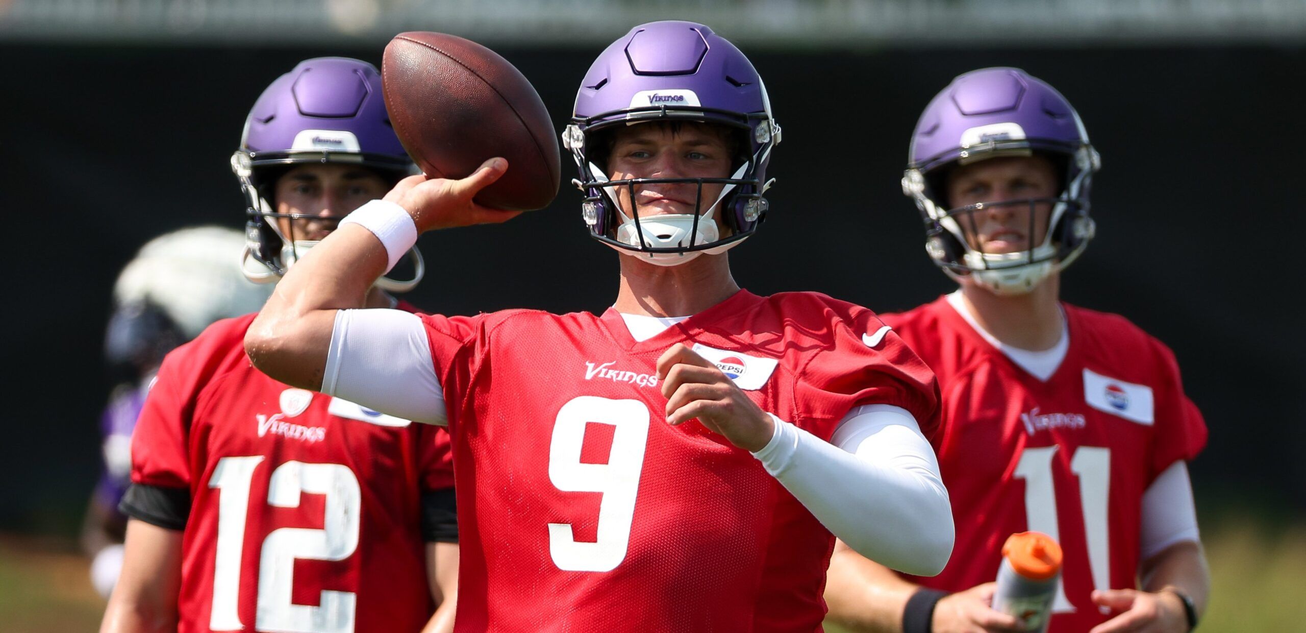 J.J. McCarthy runs drills at Vikings training camp in Eagan.