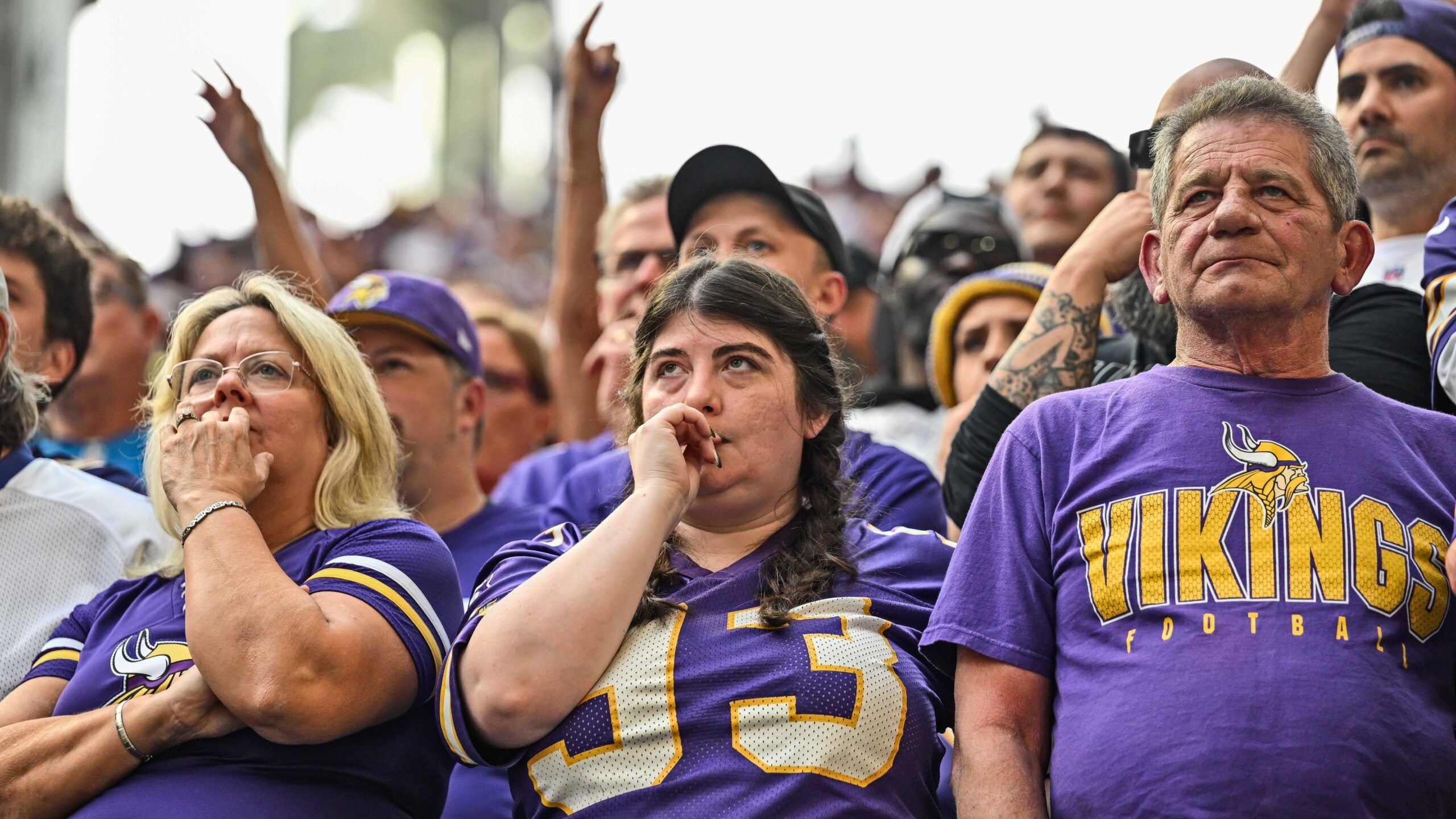 Vikings fans react emotionally late in a home game against the Lions.