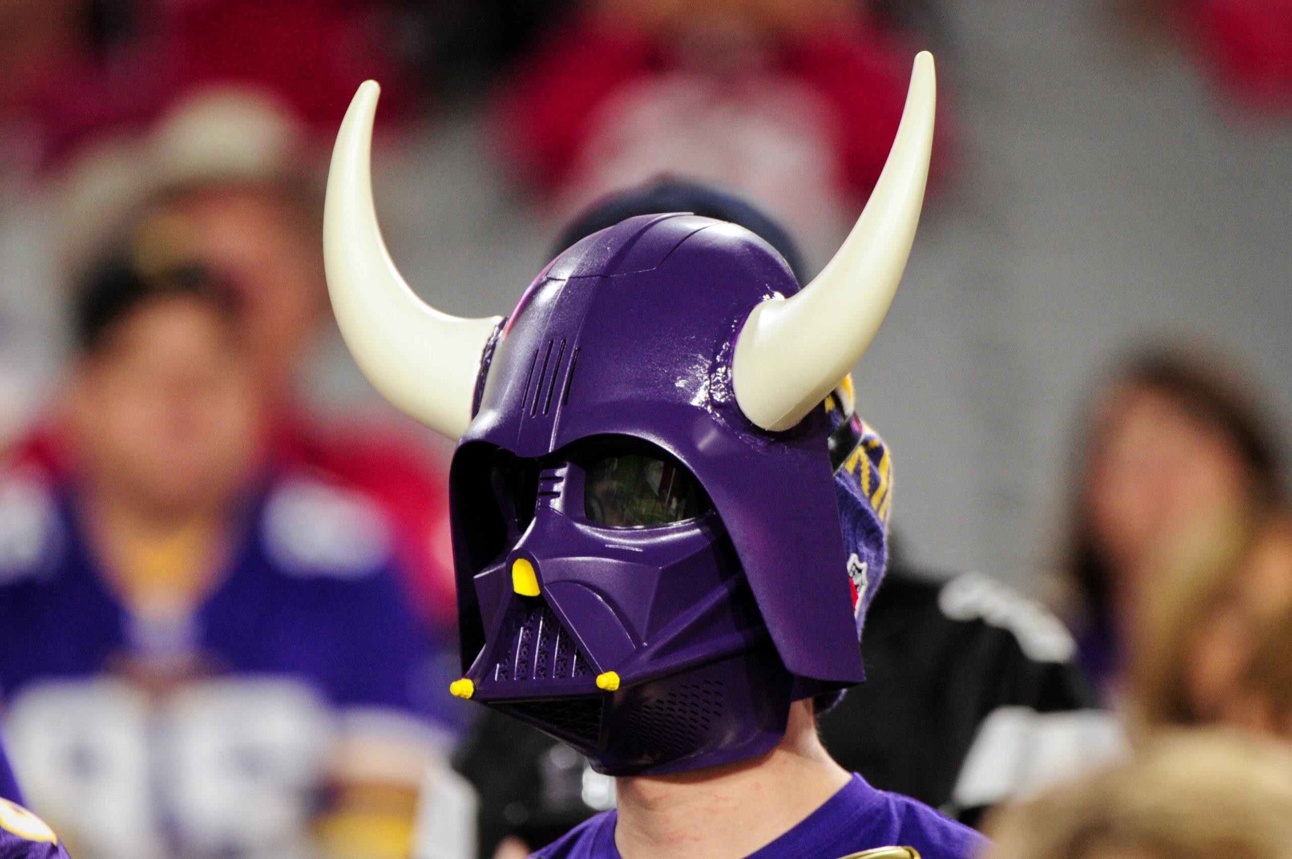 A Minnesota Vikings fan watches pregame activities before a road game against the Arizona Cardinals in Glendale, Arizona.