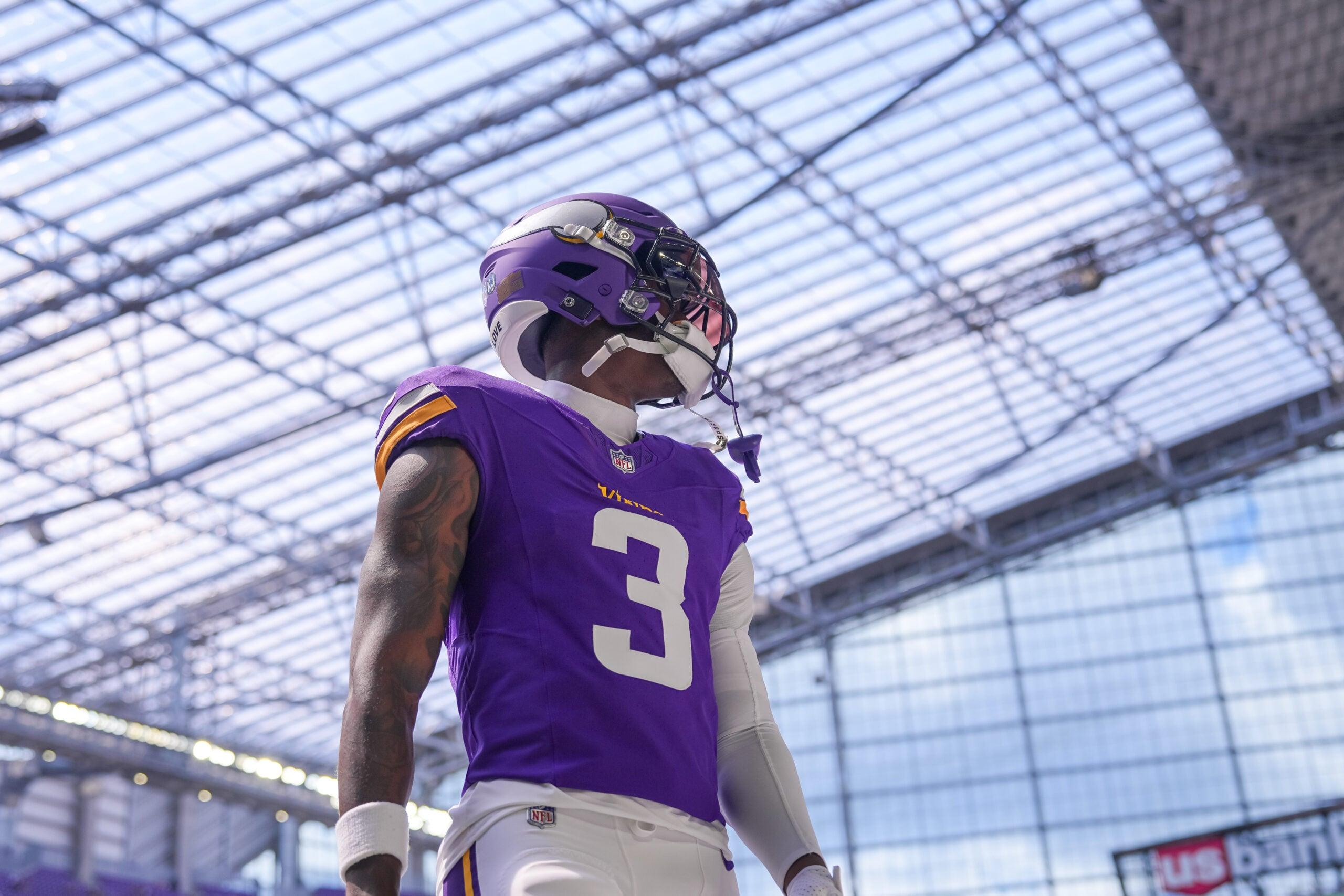 Jordan Addison stretches during pregame warmups before a Vikings preseason game against the Raiders at U.S. Bank Stadium.