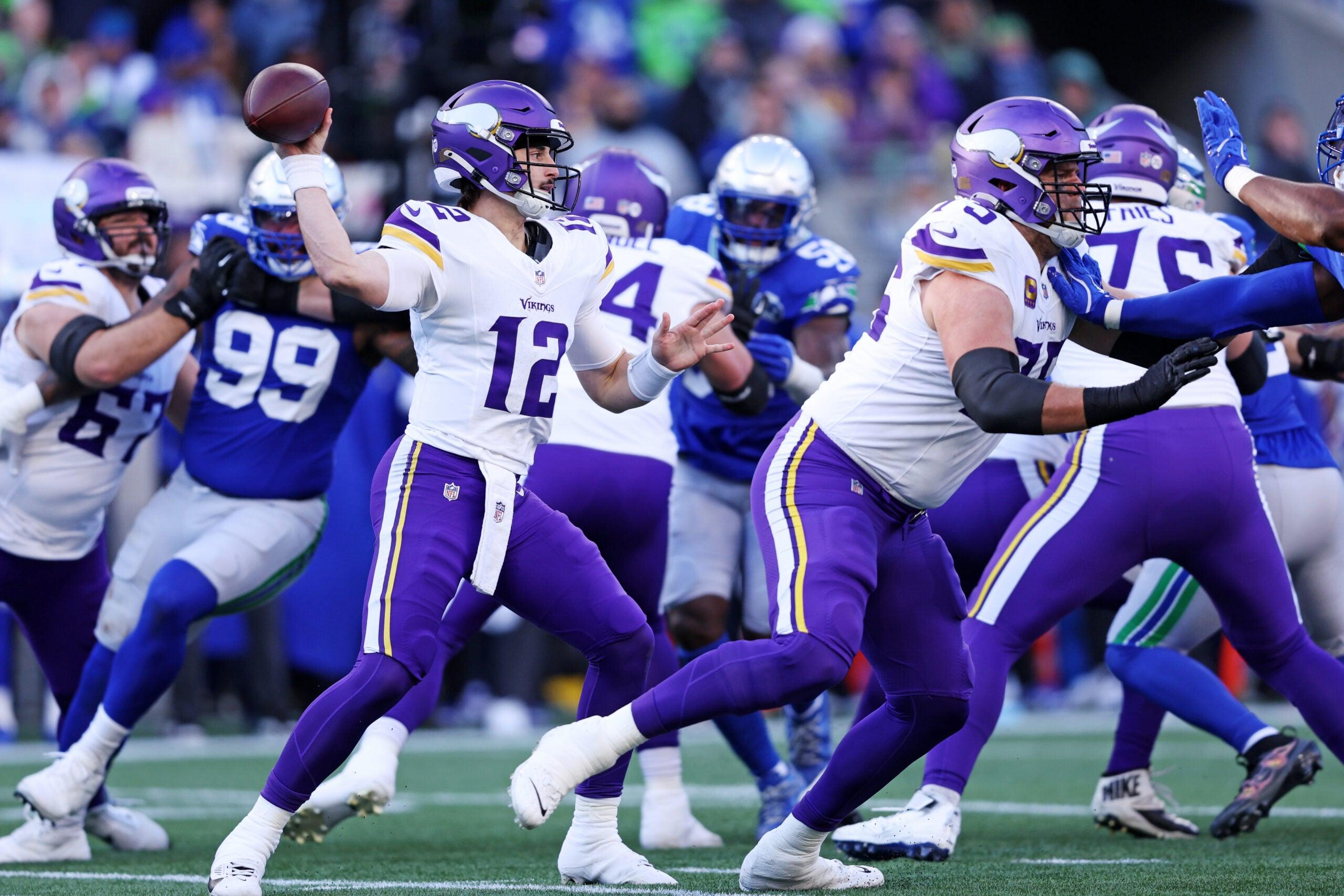 Vikings quarterback Max Brosmer drops back to pass against the Seattle Seahawks at Lumen Field.