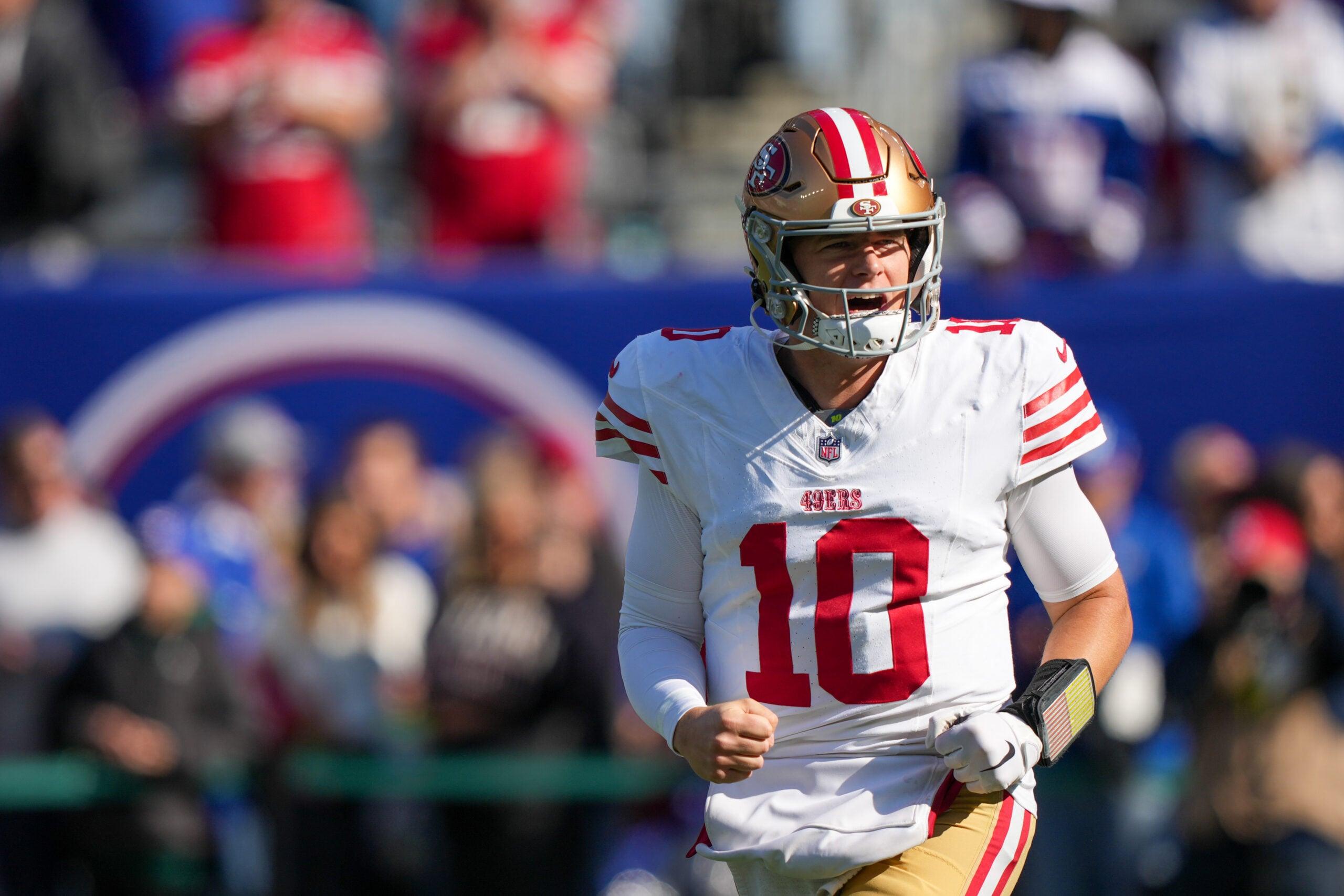 Mac Jones warms up before a San Francisco 49ers game against the New York Giants at MetLife Stadium.