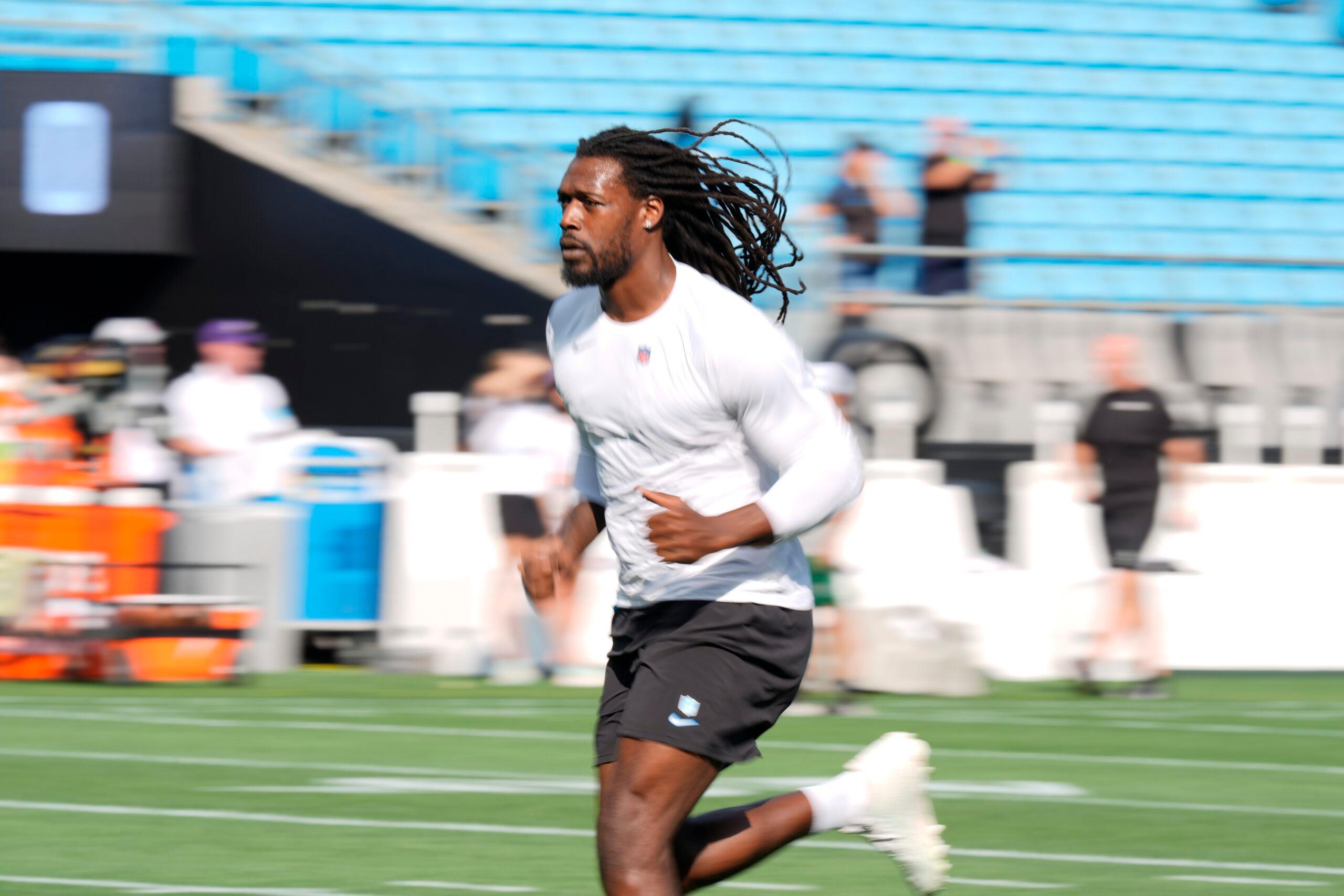 Jadeveon Clowney warms up before a Panthers preseason game against the New York Jets at Bank of America Stadium.