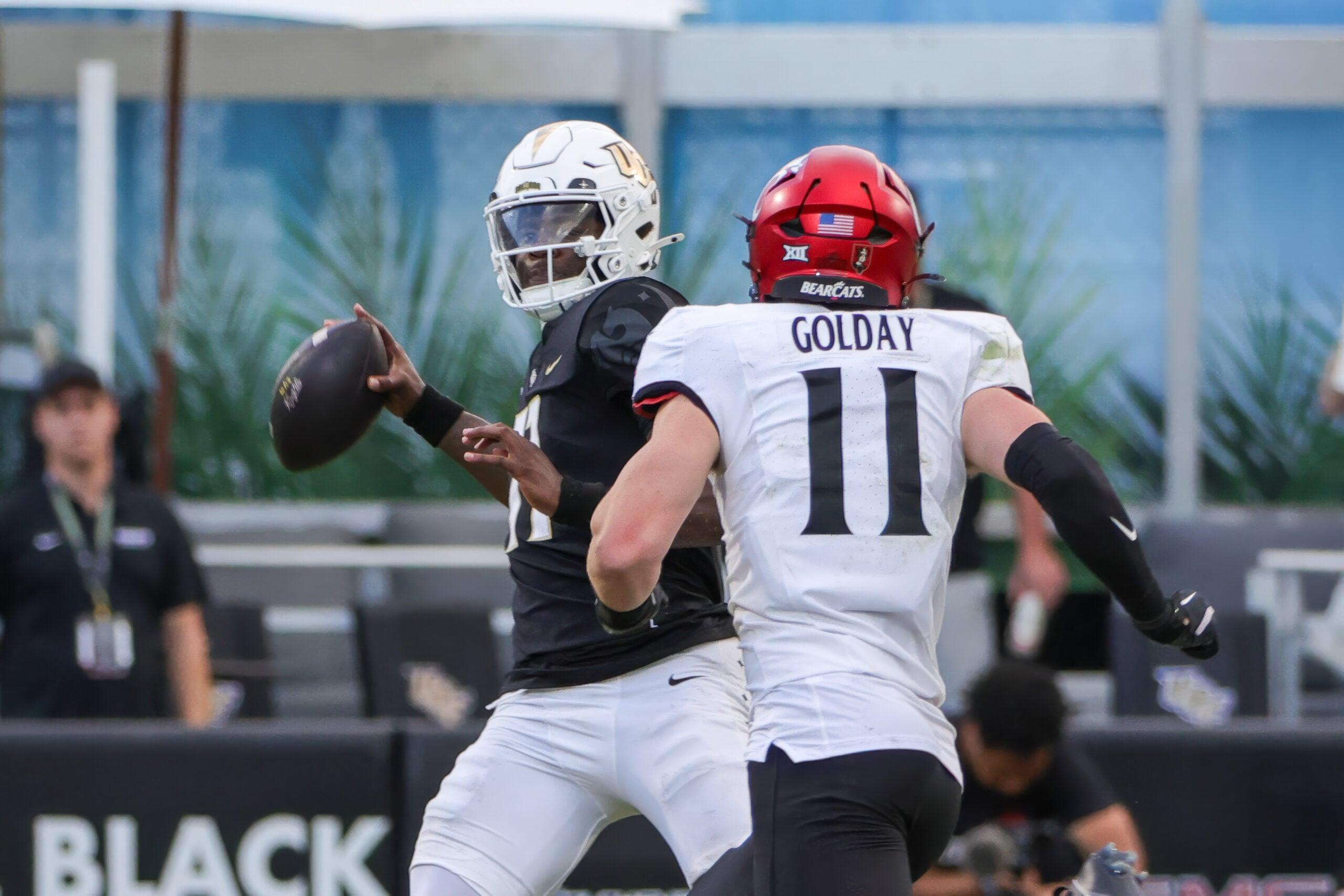UCF Knights quarterback Jacurri Brown looks to throw a pass during a game against the Cincinnati Bearcats at FBC Mortgage Stadium.
