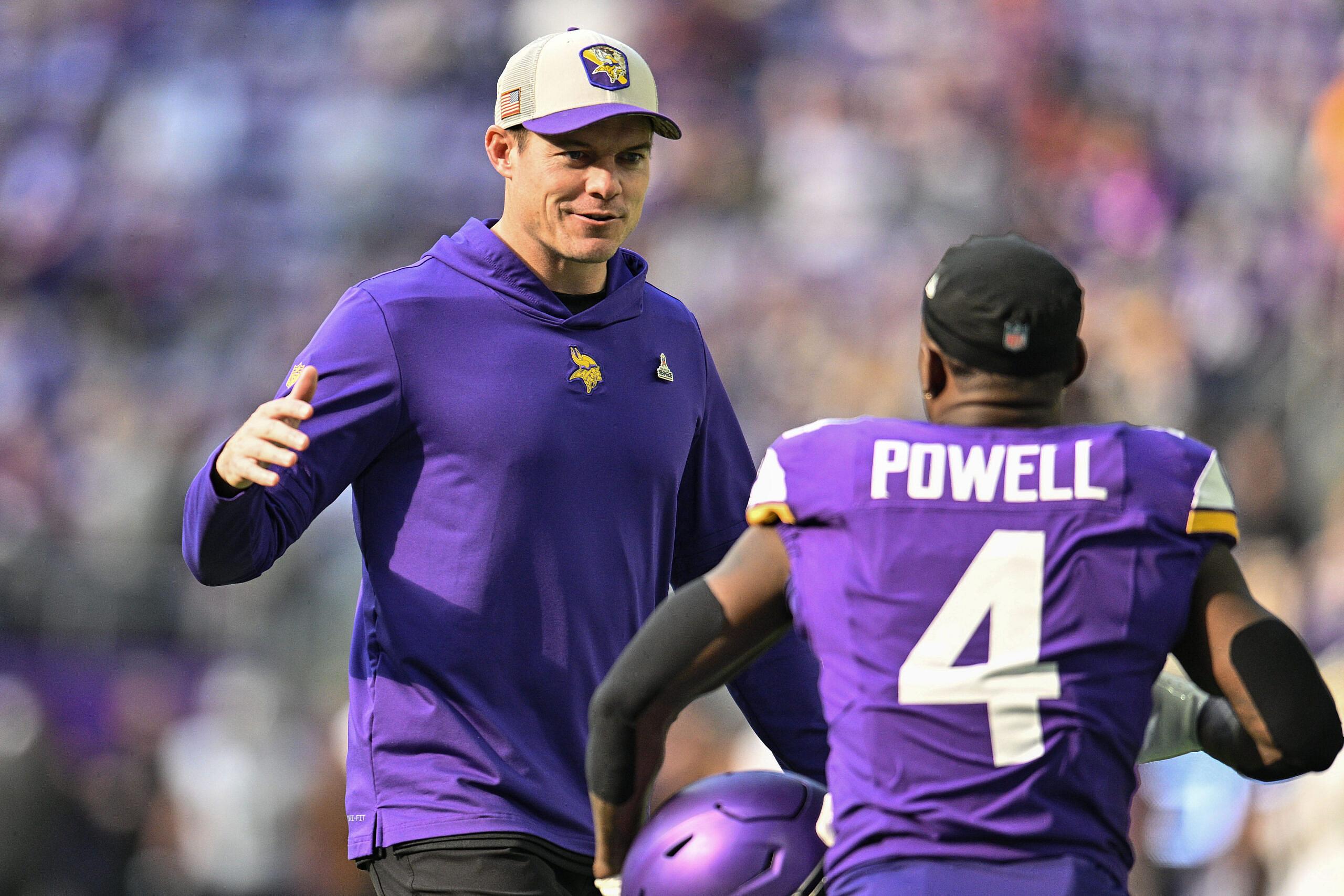 Kevin O’Connell reacts with Brandon Powell before facing the Saints.