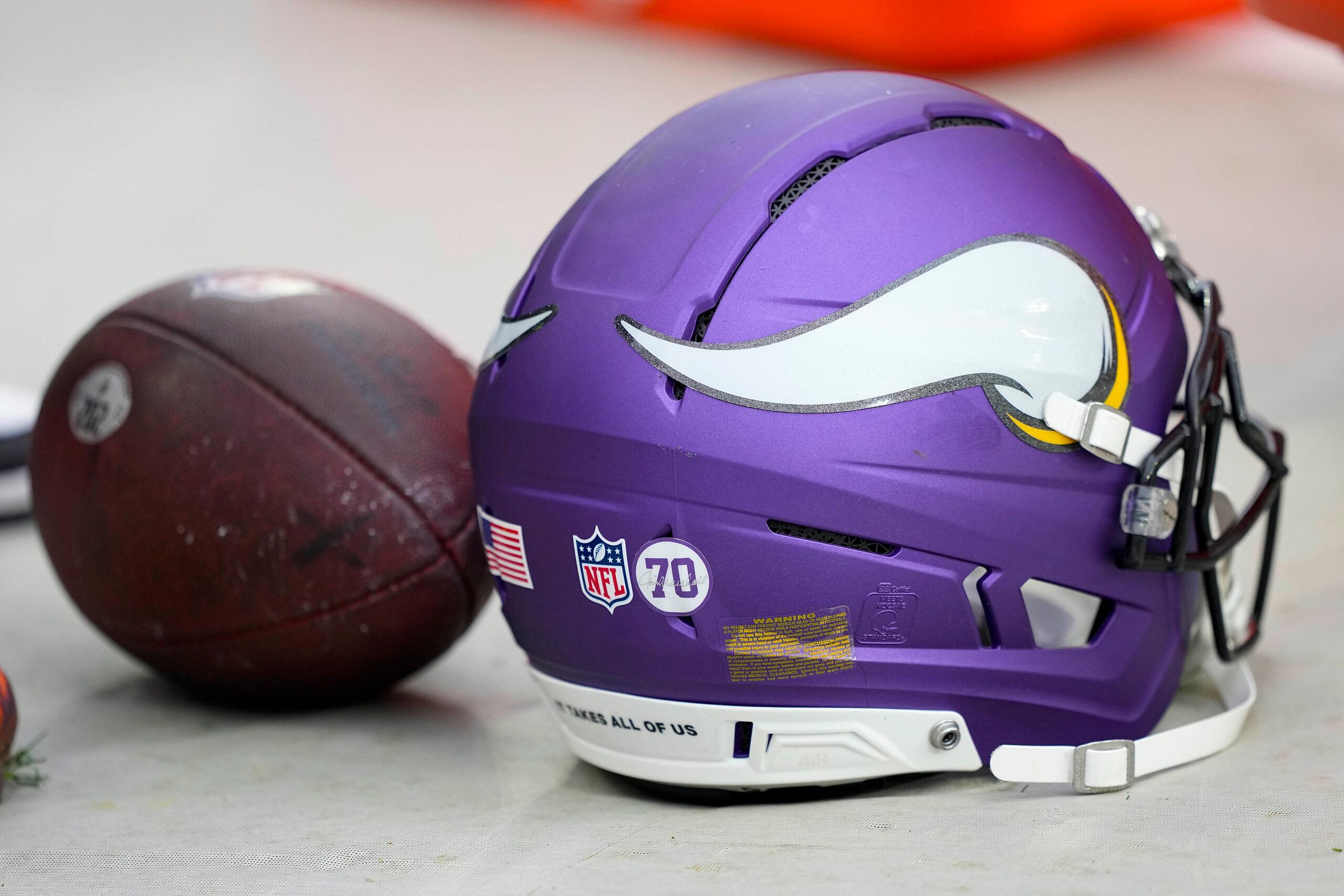 Minnesota Vikings helmet resting on the field before a game at Lambeau Field.
