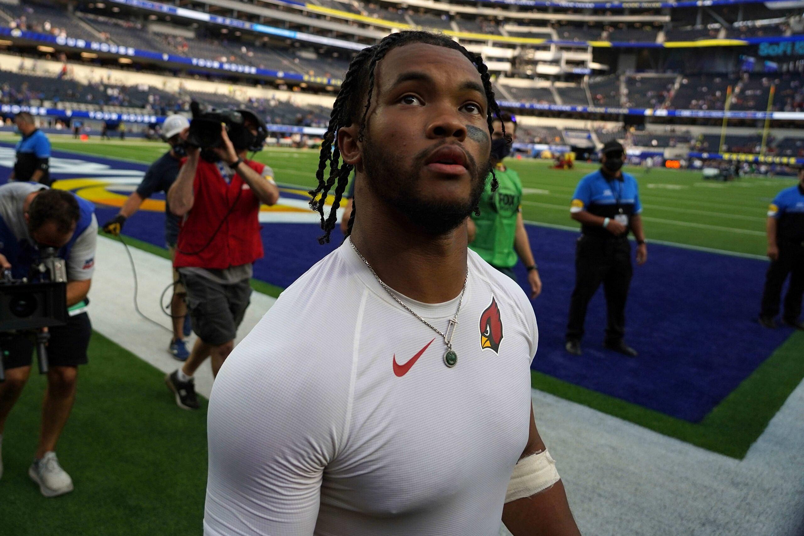 Kyler Murray walks off the field after the Cardinals defeated the Rams.