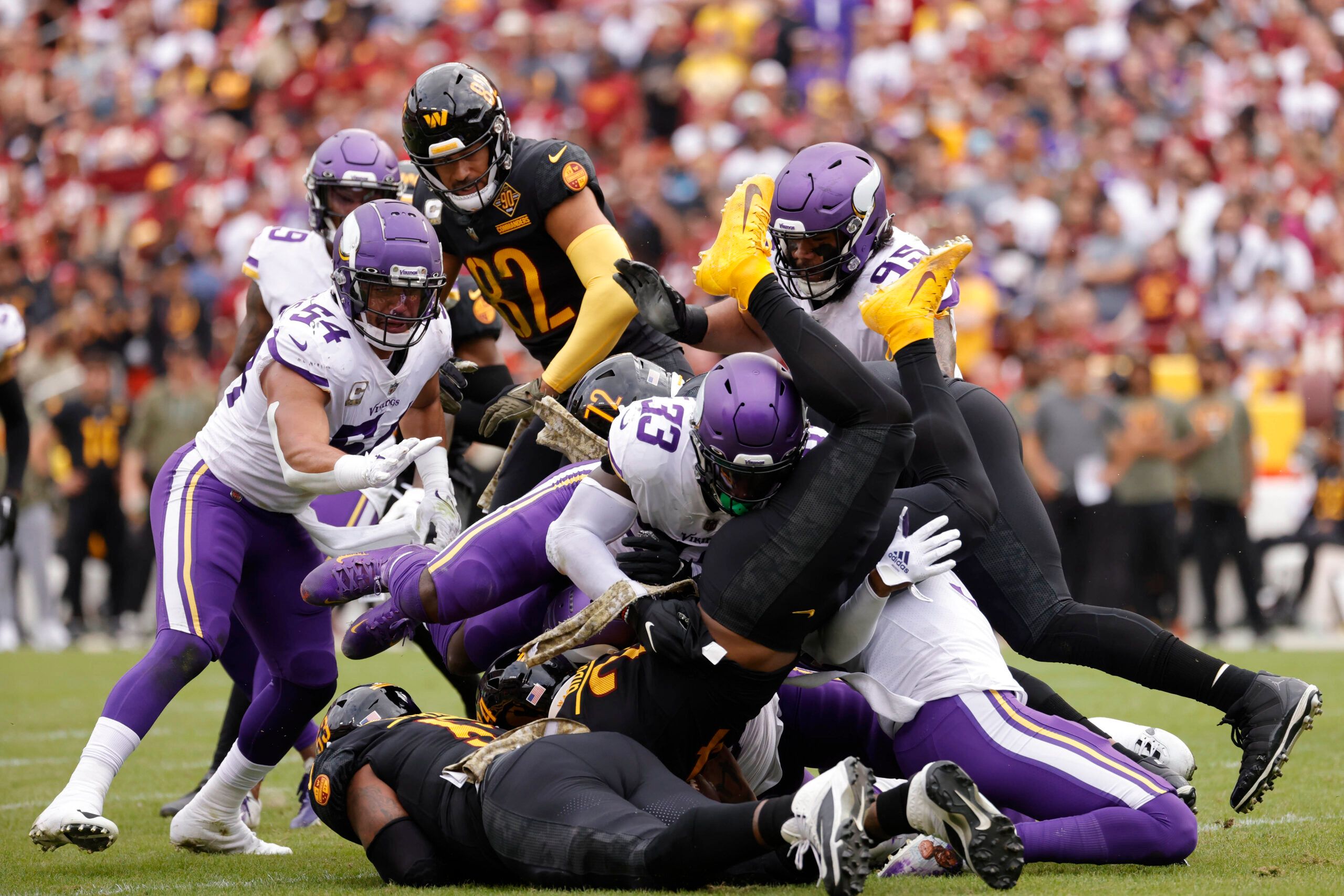 Brian Asamoah tackles Antonio Gibson during a Vikings vs. Commanders game.