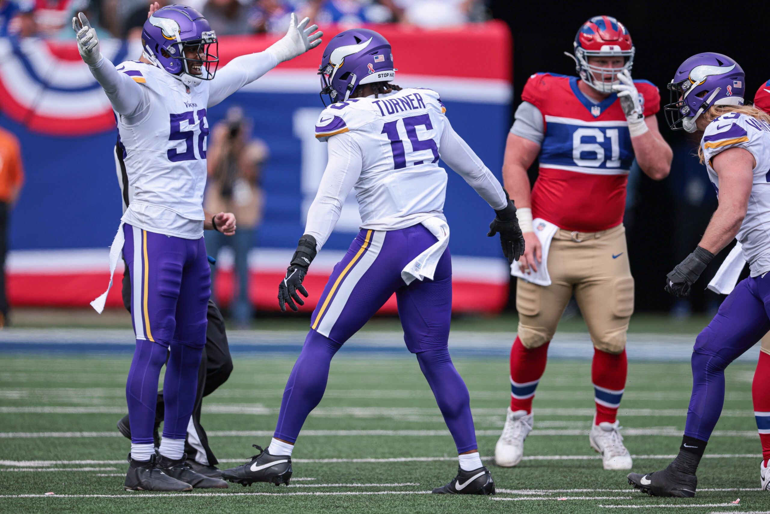 Minnesota Vikings linebacker Jonathan Greenard and Dallas Turner celebrate a sack against the Giants.