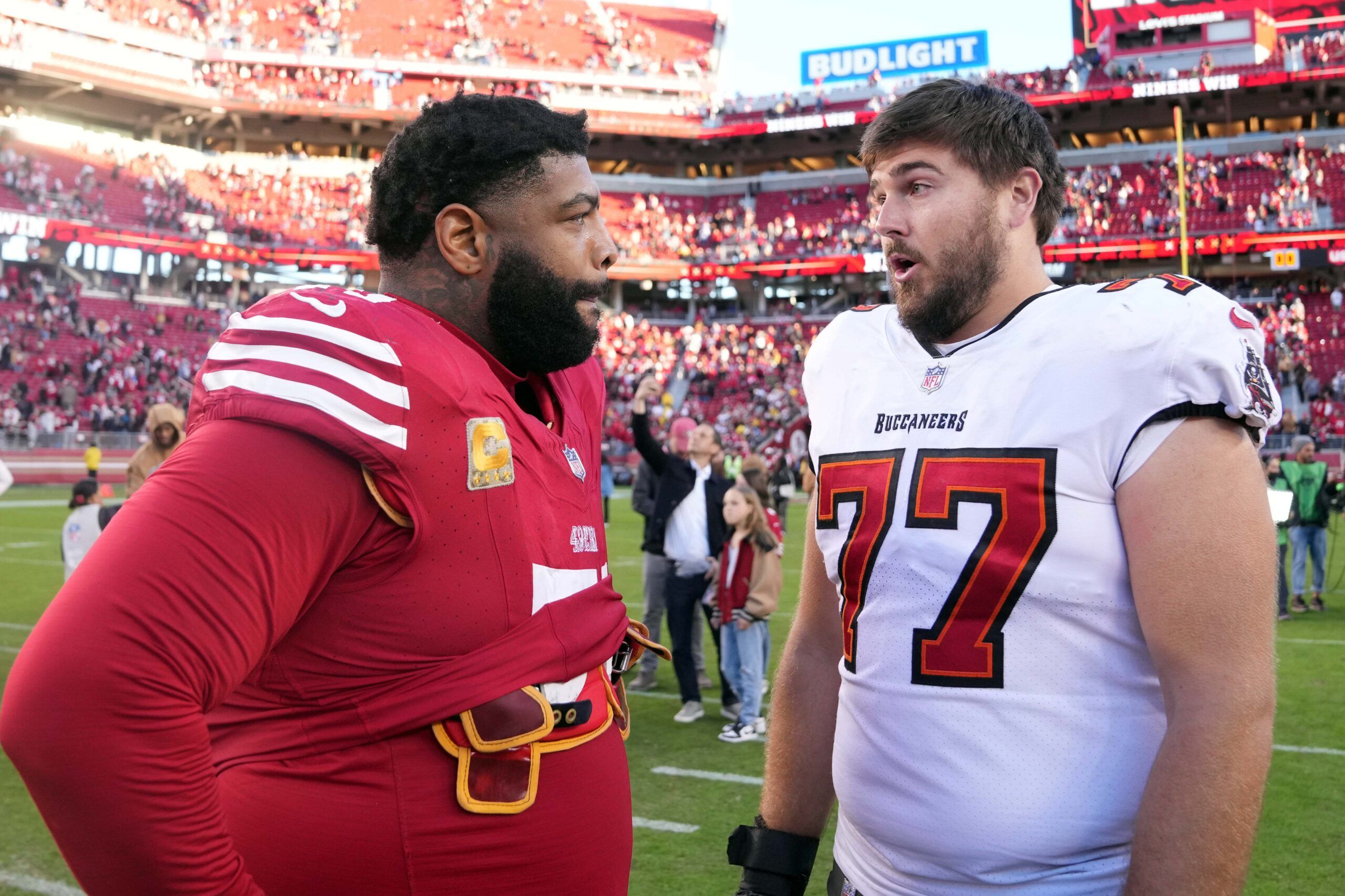 Trent Williams and Justin Skule chatting in 2023.