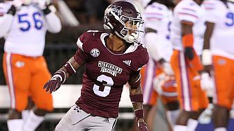 Football player in maroon jersey number 3 celebrating during game.