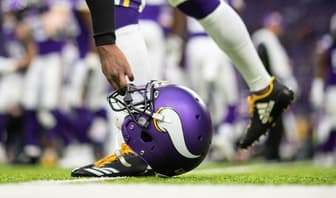 Mackensie Alexander picks up his helmet before Vikings vs. Bears game on Dec. 29, 2019.