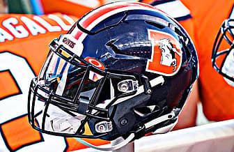 Denver Broncos helmet on sideline at Empower Field.