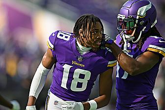 Justin Jefferson and K.J. Osborn stand together during a game against the Bears.