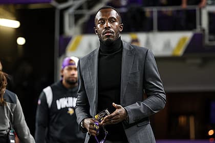 Kwesi Adofo-Mensah stands on the field before a Vikings game at U.S. Bank Stadium.