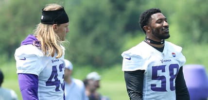 Vikings linebackers Van Ginkel and Greenard talk during minicamp.