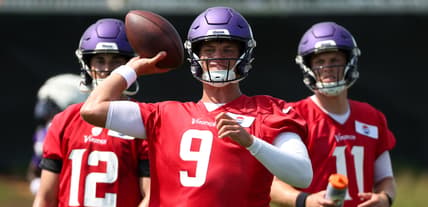 J.J. McCarthy runs drills at Vikings training camp in Eagan.