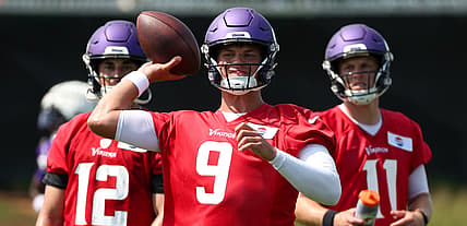 J.J. McCarthy runs drills at Vikings training camp in Eagan.