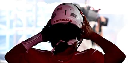Kyler Murray wears his helmet during pregame warmups before a Cardinals game against the Falcons.