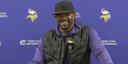 Brian Flores speaks with reporters at the TCO Performance Center during the 2024 Vikings season.