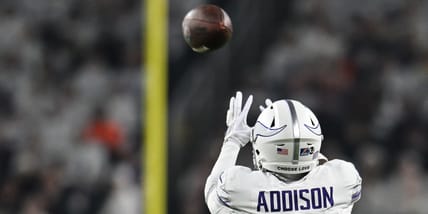 Jordan Addison reaches for a pass in 2024 agains the Chicago Bears.