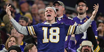 Vikings fans react during a home game against the Packers at U.S. Bank Stadium.