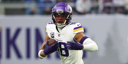 Justin Jefferson runs after a catch during a Vikings game against the Detroit Lions.