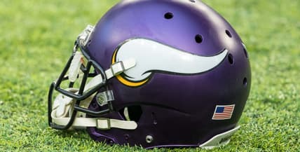 A Minnesota Vikings helmet rests on the field before a home game against the Chicago Bears.