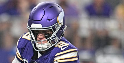J.J. McCarthy hands off to Aaron Jones Sr. during the Vikings’ game against the Falcons at U.S. Bank Stadium.