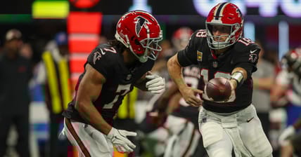 Bijan Robinson and Kirk Cousins with the Falcons in 2024.