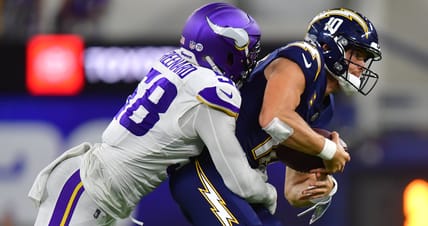 Jonathan Greenard pressures Justin Herbert during Vikings vs. Chargers game at SoFi Stadium.