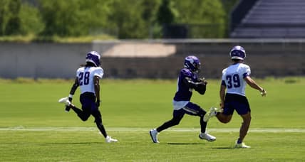 Kyler Murray throws a pass to Dillon Bell during Vikings minicamp practice in Eagan.