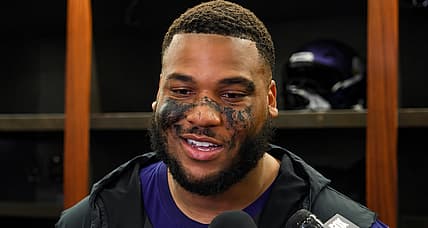 Christian Darrisaw speaks with reporters after a Vikings win over the Bengals.