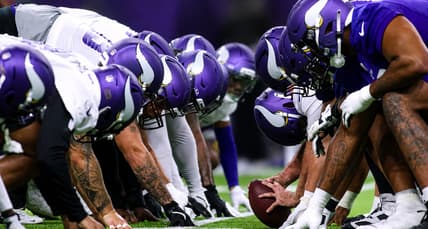 Vikings players line up at the line of scrimmage during minicamp in Eagan.