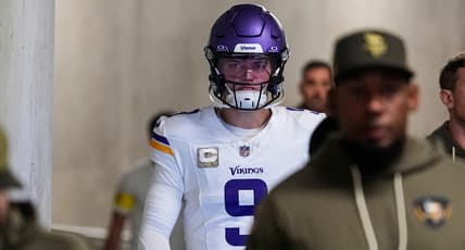 J.J. McCarthy walks through the tunnel before a Vikings game against the Lions at Ford Field.