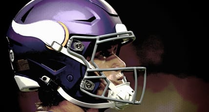 J.J. McCarthy takes the field before a Vikings game at U.S. Bank Stadium.