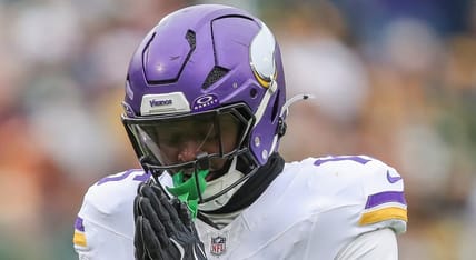 Dallas Turner celebrates sack of Jordan Love at Lambeau Field.