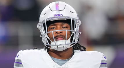 Ty Chandler warms up before a game against the Bears at U.S. Bank Stadium.