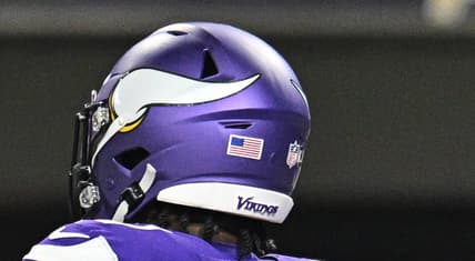 Sam Darnold and Cam Akers celebrate a touchdown against the Packers on Dec. 29, 2024, at U.S. Bank Stadium.