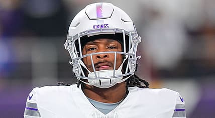 Ty Chandler warms up before a game against the Bears at U.S. Bank Stadium.