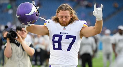 T.J. Hockenson waves to fans during Vikings game at Nissan Stadium.