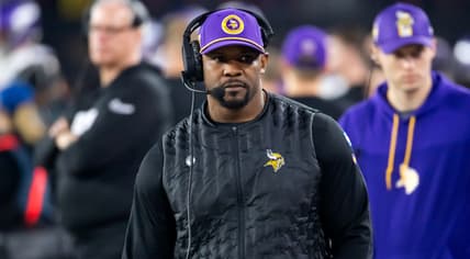 Brian Flores on the sideline during a Vikings playoff game against the Rams.