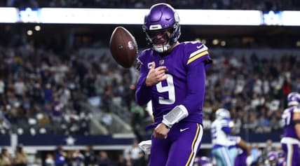 J.J. McCarthy celebrates after a touchdown against the Dallas Cowboys at AT&T Stadium.