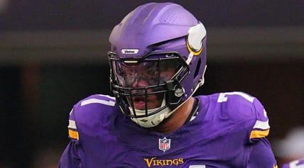 Christian Darrisaw lines up at left tackle for the Vikings during a game at U.S. Bank Stadium