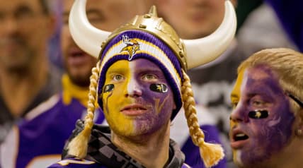 A Vikings fan watches a game against the Packers at the Metrodome.